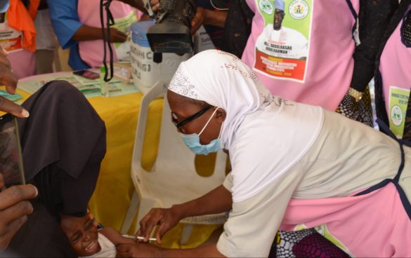 A Nurse administers second dose measles vaccination to a child at Pakata primary health care center